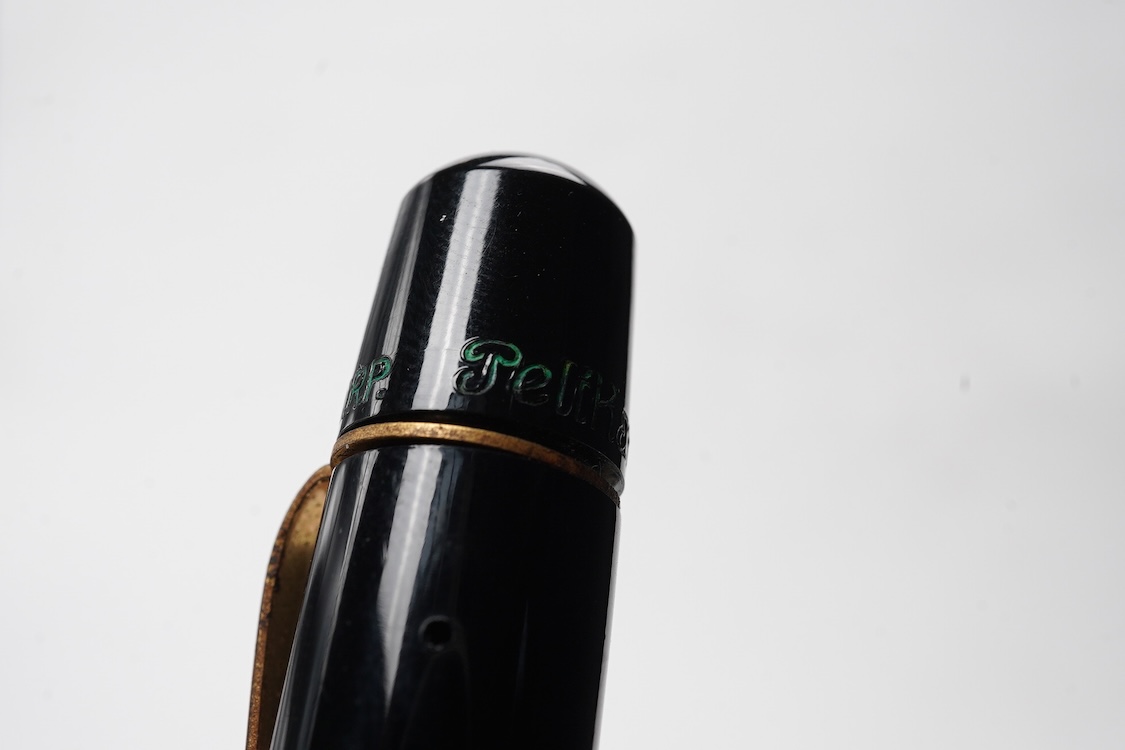 A Pelikan 100N fountain pen fitted with a 14ct. gold Pelkan nib